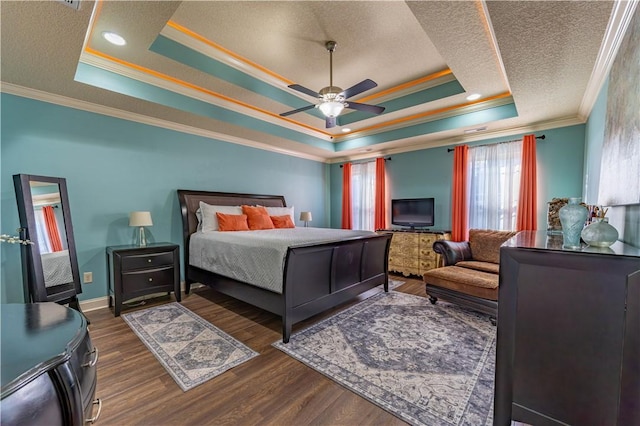 2444 Poole Rd, Greer, SC 29650 - bedroom featuring ornamental molding, a raised ceiling, a textured ceiling, dark wood finished floors, and a ceiling fan