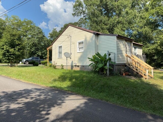 715 Delia St, Anderson, SC 29624 - view of property exterior with a lawn, crawl space, and view of wooded area