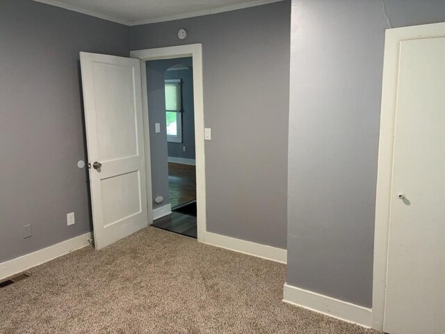 715 Delia St, Anderson, SC 29624 - empty room featuring crown molding, carpet floors, and a smoke detector