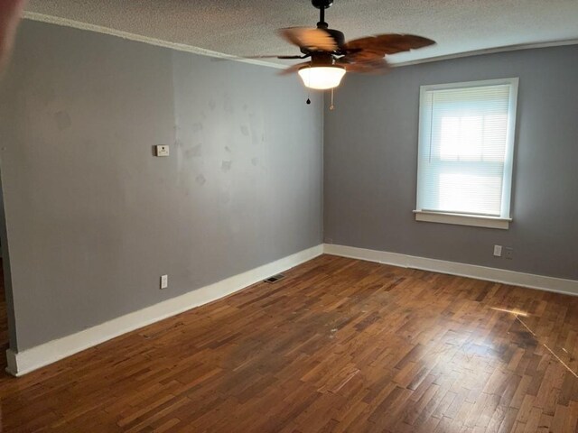 715 Delia St, Anderson, SC 29624 - spare room featuring ceiling fan, a textured ceiling, and dark wood-type flooring