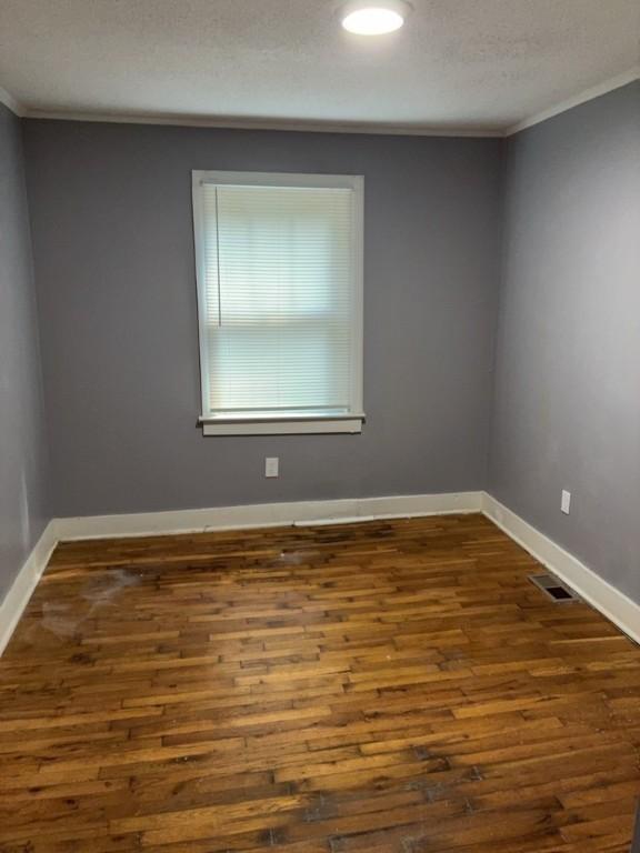 715 Delia St, Anderson, SC 29624 - unfurnished room with ornamental molding, dark wood-type flooring, and recessed lighting