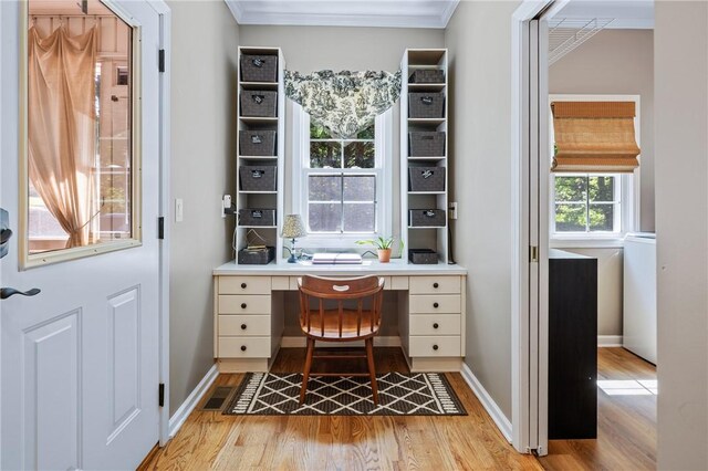 308 Amethyst Way, Seneca, SC 29672 - home office with light wood-style floors, ornamental molding, and built in desk