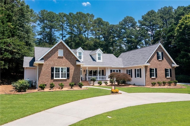 308 Amethyst Way, Seneca, SC 29672 - view of front facade with covered porch, brick siding, and a front yard