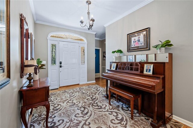 308 Amethyst Way, Seneca, SC 29672 - entrance foyer with wood finished floors, crown molding, and a chandelier