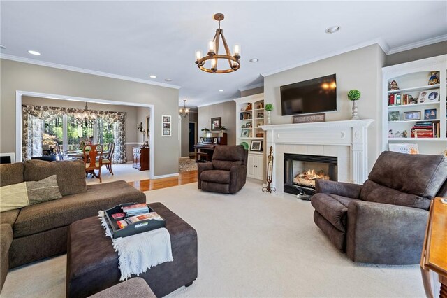 308 Amethyst Way, Seneca, SC 29672 - living area with a chandelier, ornamental molding, recessed lighting, a tiled fireplace, and built in features