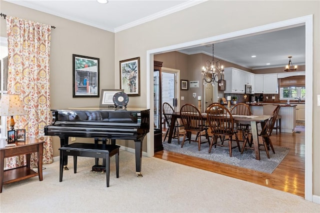 308 Amethyst Way, Seneca, SC 29672 - dining room with crown molding, light wood-style flooring, recessed lighting, a chandelier, and light colored carpet