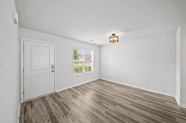 121 Traditions Blvd, Anderson, SC 29625 - unfurnished room with wood finished floors and a chandelier
