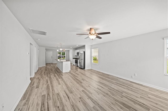 121 Traditions Blvd, Anderson, SC 29625 - unfurnished living room with a ceiling fan, light wood-type flooring, and recessed lighting