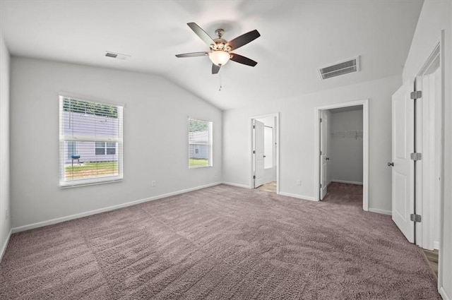 121 Traditions Blvd, Anderson, SC 29625 - unfurnished bedroom featuring vaulted ceiling, carpet, a spacious closet, ceiling fan, and a closet
