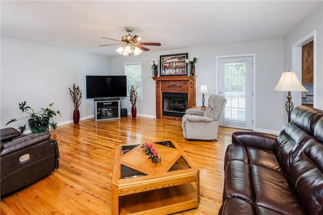 100 Crosscreek Dr, Anderson, SC 29621 - living area with wood finished floors, ceiling fan, and a fireplace
