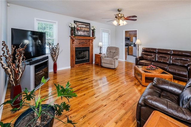 100 Crosscreek Dr, Anderson, SC 29621 - living area with a fireplace, light wood-type flooring, and a ceiling fan