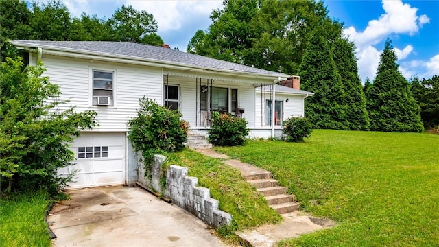 7703 Moorefield Memorial Hwy, Liberty, SC 29657 - view of front of house with covered porch, a garage, a front lawn, concrete driveway, and a chimney