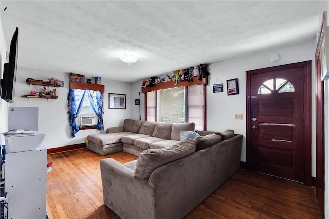 7703 Moorefield Memorial Hwy, Liberty, SC 29657 - living room with dark wood-style flooring, a textured ceiling, and cooling unit