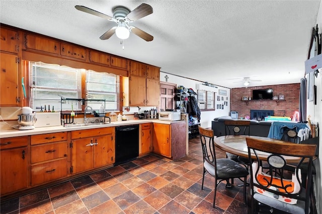 7703 Moorefield Memorial Hwy, Liberty, SC 29657 - kitchen with black dishwasher, a ceiling fan, a brick fireplace, light countertops, and a textured ceiling