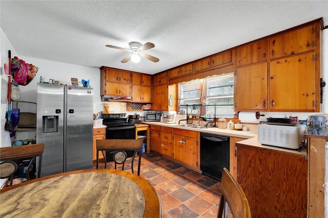 7703 Moorefield Memorial Hwy, Liberty, SC 29657 - kitchen featuring black appliances, ceiling fan, brown cabinetry, a textured ceiling, and light countertops