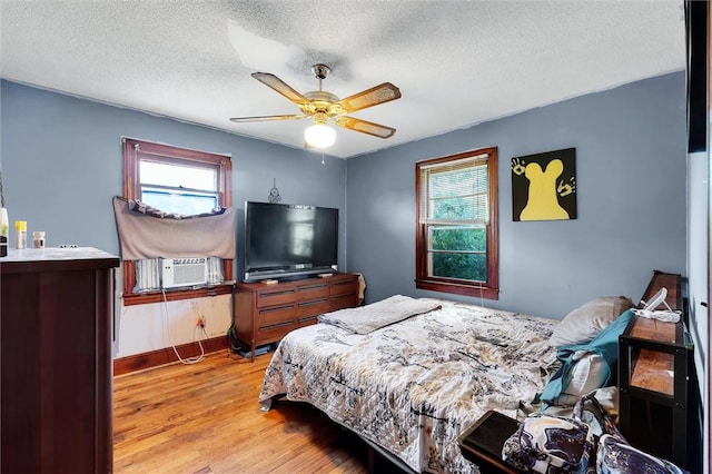 7703 Moorefield Memorial Hwy, Liberty, SC 29657 - bedroom with cooling unit, wood finished floors, a textured ceiling, and a ceiling fan