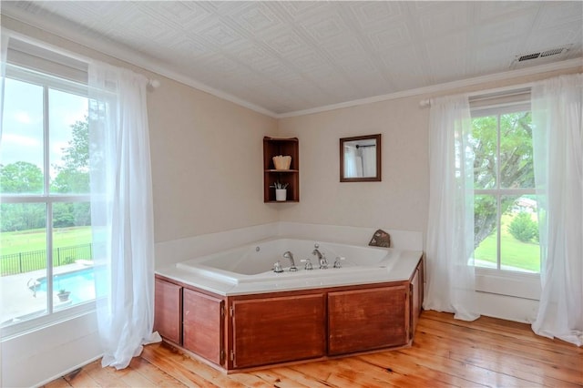 251 W Mcelhaney Rd, Taylors, SC 29687 - full bath featuring a bath, hardwood / wood-style floors, plenty of natural light, and ornamental molding