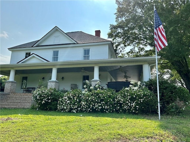 251 W Mcelhaney Rd, Taylors, SC 29687 - farmhouse-style home with ceiling fan, a front yard, a chimney, and covered porch
