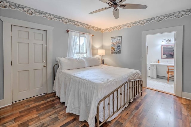 251 W Mcelhaney Rd, Taylors, SC 29687 - bedroom featuring hardwood / wood-style flooring, connected bathroom, and a ceiling fan