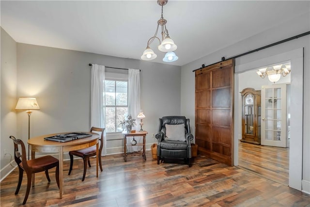 251 W Mcelhaney Rd, Taylors, SC 29687 - sitting room featuring a barn door, wood finished floors, and a chandelier