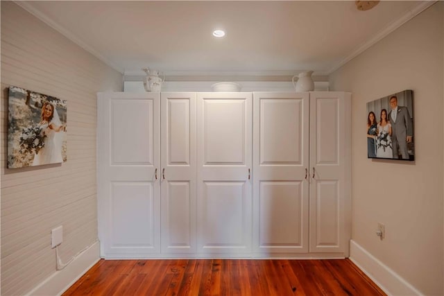 251 W Mcelhaney Rd, Taylors, SC 29687 - unfurnished bedroom with crown molding, wood finished floors, and a closet