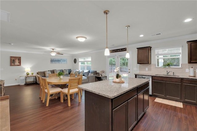 220 Celebration Ave, Anderson, SC 29625 - kitchen featuring dark wood-style flooring, dishwasher, open floor plan, crown molding, and dark brown cabinets