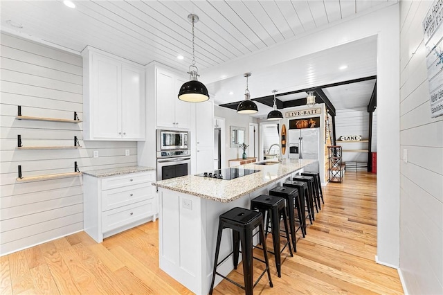 1047 Tranquility Ln, Hartwell, GA 30643 - kitchen with stainless steel appliances, light wood-type flooring, wood ceiling, white cabinetry, and recessed lighting