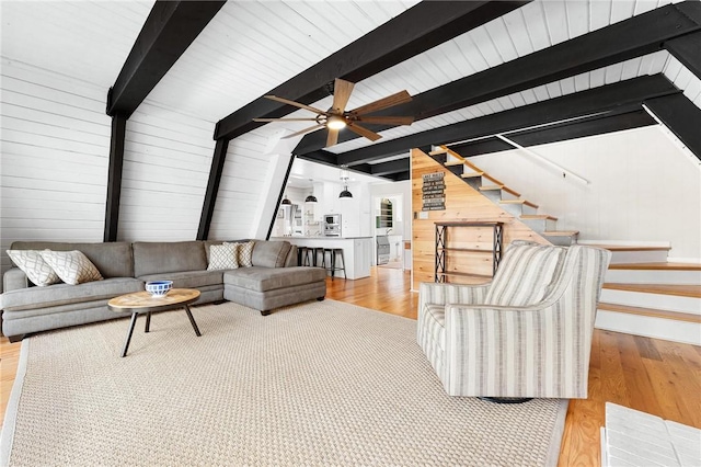 1047 Tranquility Ln, Hartwell, GA 30643 - living area with ceiling fan, stairway, wood finished floors, and wooden walls