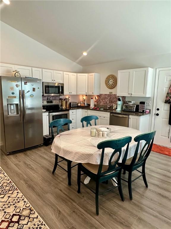 118 Branch St, Walhalla, SC 29691 - dining area with lofted ceiling and light wood-style floors