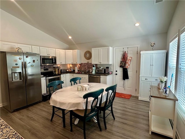 118 Branch St, Walhalla, SC 29691 - dining area featuring lofted ceiling, dark wood finished floors, and recessed lighting