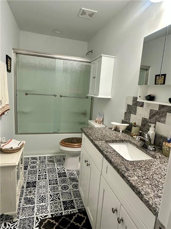 118 Branch St, Walhalla, SC 29691 - bathroom with vanity and bath / shower combo with glass door