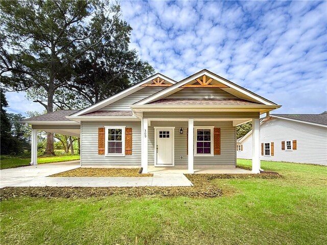 330 Code Cir, Seneca, SC 29678 - bungalow-style house with a front yard, driveway, an attached carport, and covered porch