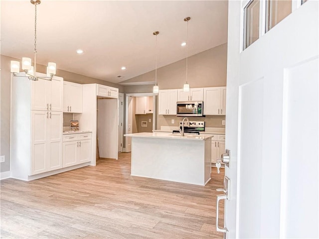 330 Code Cir, Seneca, SC 29678 - kitchen with stainless steel microwave, white cabinetry, light wood-style floors, light countertops, and recessed lighting
