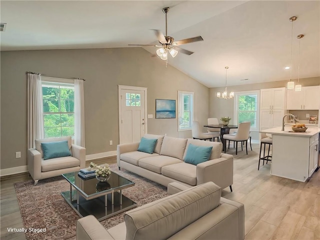 330 Code Cir, Seneca, SC 29678 - living room with light wood-style flooring, a chandelier, lofted ceiling, and ceiling fan