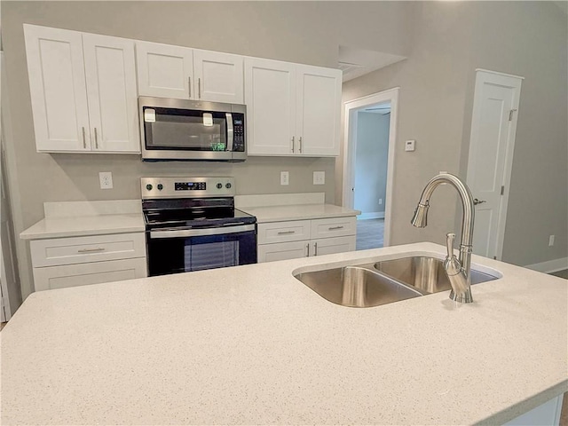 330 Code Cir, Seneca, SC 29678 - kitchen with stainless steel appliances, white cabinets, and light countertops