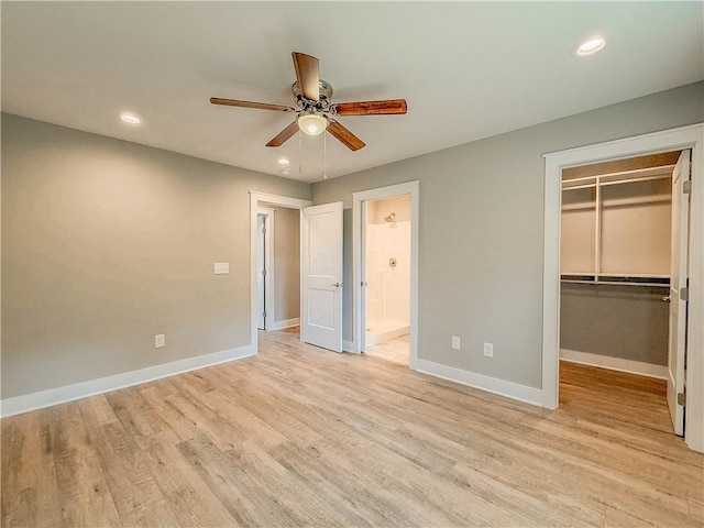 330 Code Cir, Seneca, SC 29678 - unfurnished bedroom with a walk in closet, light wood-type flooring, recessed lighting, ensuite bath, and a ceiling fan