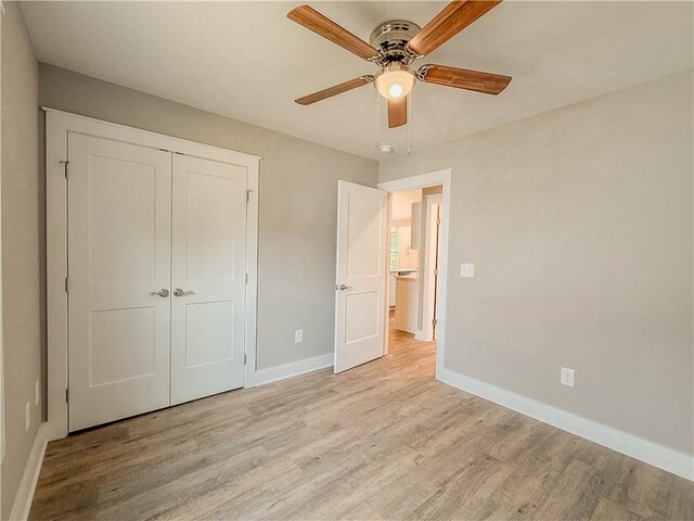 330 Code Cir, Seneca, SC 29678 - unfurnished bedroom featuring light wood-style flooring, a closet, and a ceiling fan