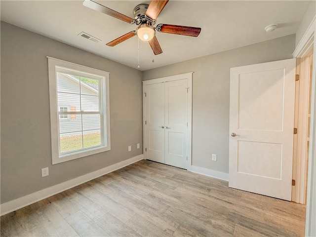 330 Code Cir, Seneca, SC 29678 - unfurnished bedroom featuring light wood finished floors, a closet, and a ceiling fan