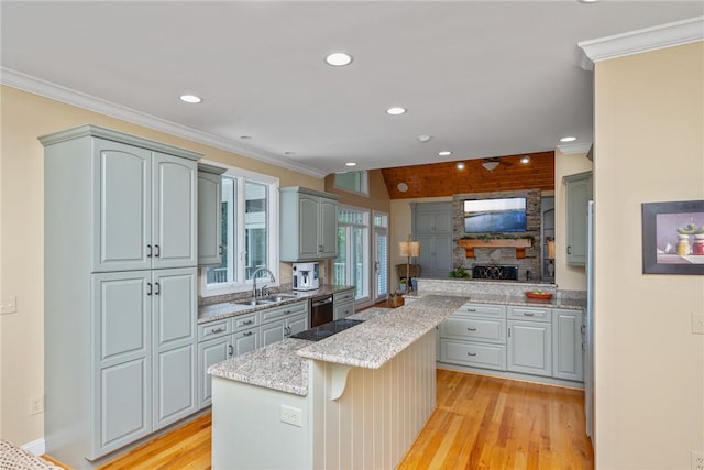 120 Links View Ct, Sunset, SC 29685 - kitchen with a kitchen island, light wood-style floors, light stone countertops, recessed lighting, and ornamental molding