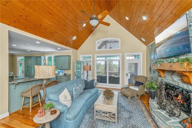 120 Links View Ct, Sunset, SC 29685 - living room with wood finished floors, ceiling fan, a stone fireplace, high vaulted ceiling, and healthy amount of natural light
