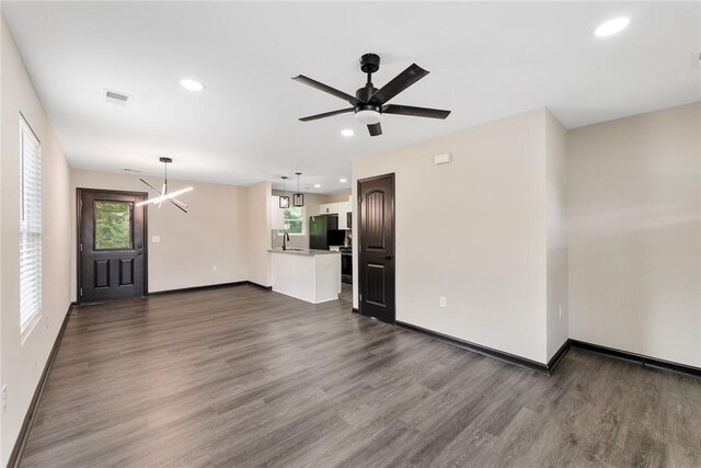 108 Hunter St, Anderson, SC 29625 - unfurnished living room featuring dark wood-style floors, ceiling fan, and recessed lighting