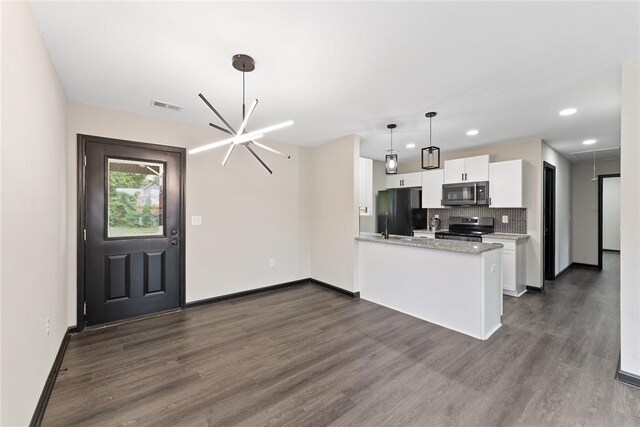 108 Hunter St, Anderson, SC 29625 - kitchen with stainless steel microwave, range with electric cooktop, freestanding refrigerator, dark wood-type flooring, and recessed lighting