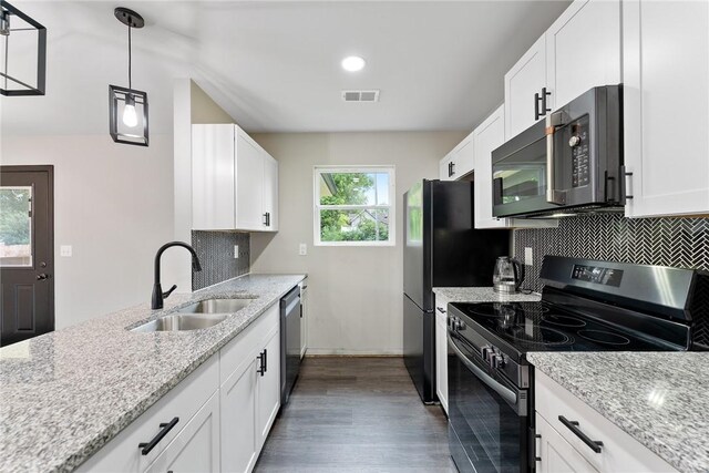 108 Hunter St, Anderson, SC 29625 - kitchen featuring range with electric cooktop, dishwasher, wood finished floors, backsplash, and white cabinets