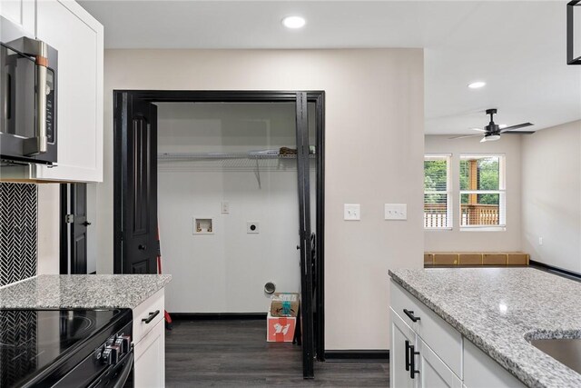 108 Hunter St, Anderson, SC 29625 - kitchen with stainless steel microwave, dark wood-type flooring, recessed lighting, white cabinetry, and light stone countertops