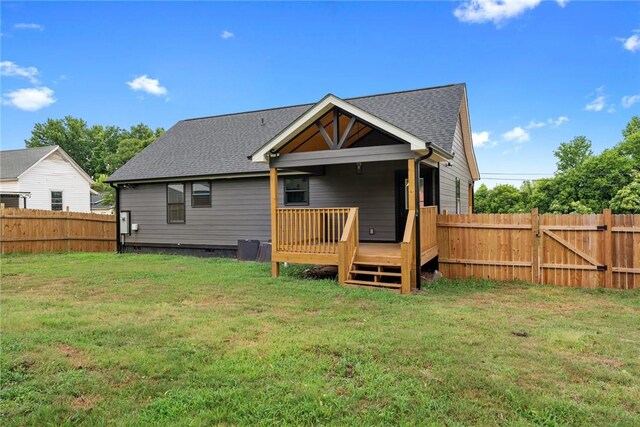 108 Hunter St, Anderson, SC 29625 - back of house with a fenced backyard, a wooden deck, and a shingled roof