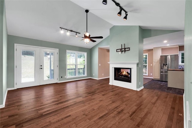 210 Briarcliff Rd, Central, SC 29630 - unfurnished living room featuring track lighting, vaulted ceiling, dark wood-type flooring, a multi sided fireplace, and ceiling fan