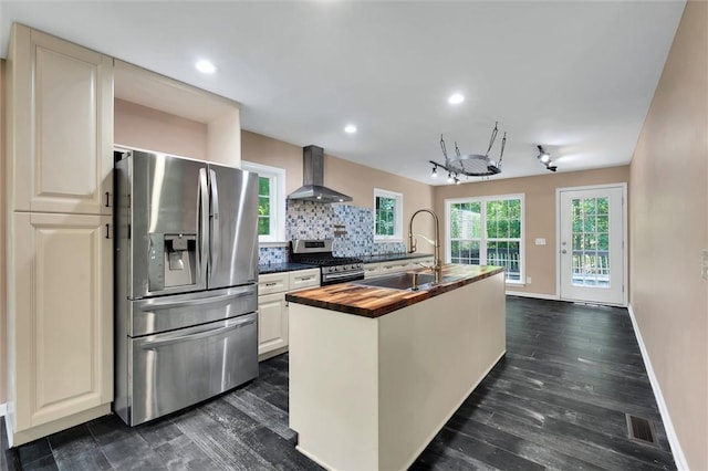 210 Briarcliff Rd, Central, SC 29630 - kitchen featuring stainless steel appliances, wood counters, wall chimney exhaust hood, backsplash, and a kitchen island with sink