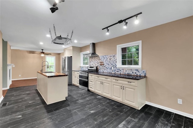 210 Briarcliff Rd, Central, SC 29630 - kitchen with appliances with stainless steel finishes, wall chimney exhaust hood, decorative backsplash, dark wood finished floors, and white cabinets