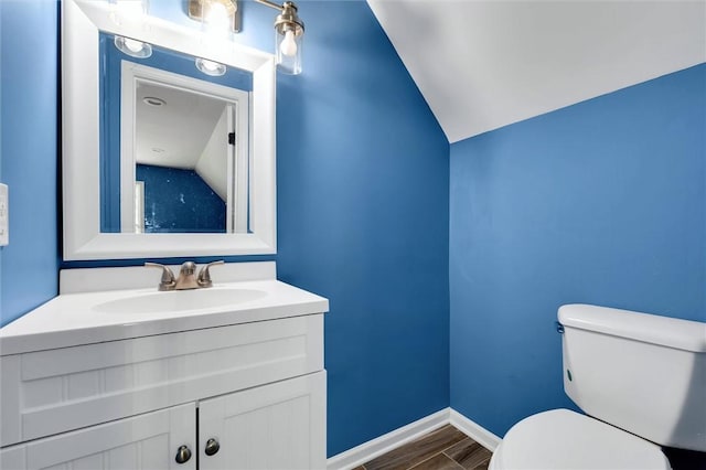 210 Briarcliff Rd, Central, SC 29630 - half bathroom with lofted ceiling, vanity, and wood finished floors