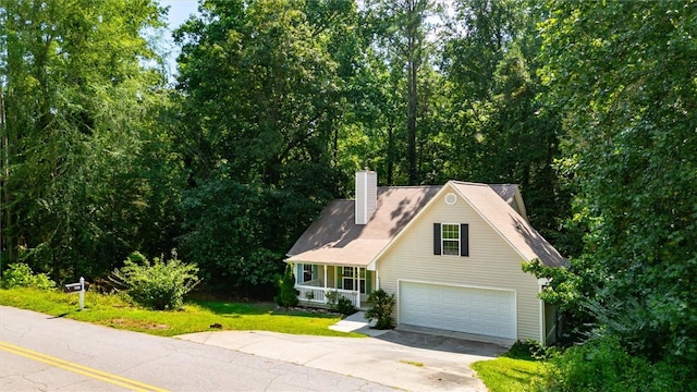 210 Briarcliff Rd, Central, SC 29630 - view of front of property with concrete driveway, a garage, a chimney, and a front lawn